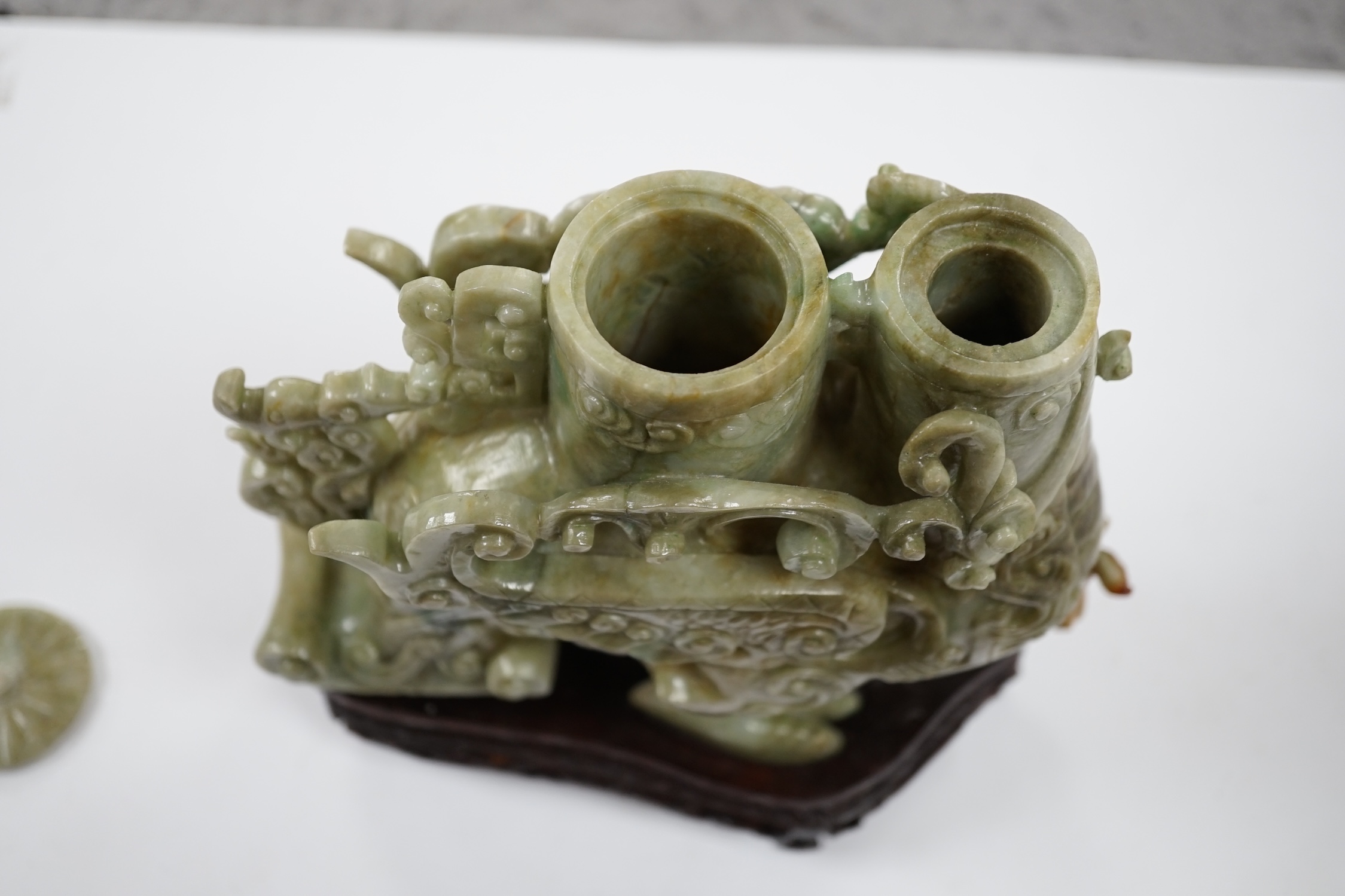 A large Chinese archaistic jadeite ‘phoenix’ vessel and cover, wood stand, 22cm high. Condition - fair